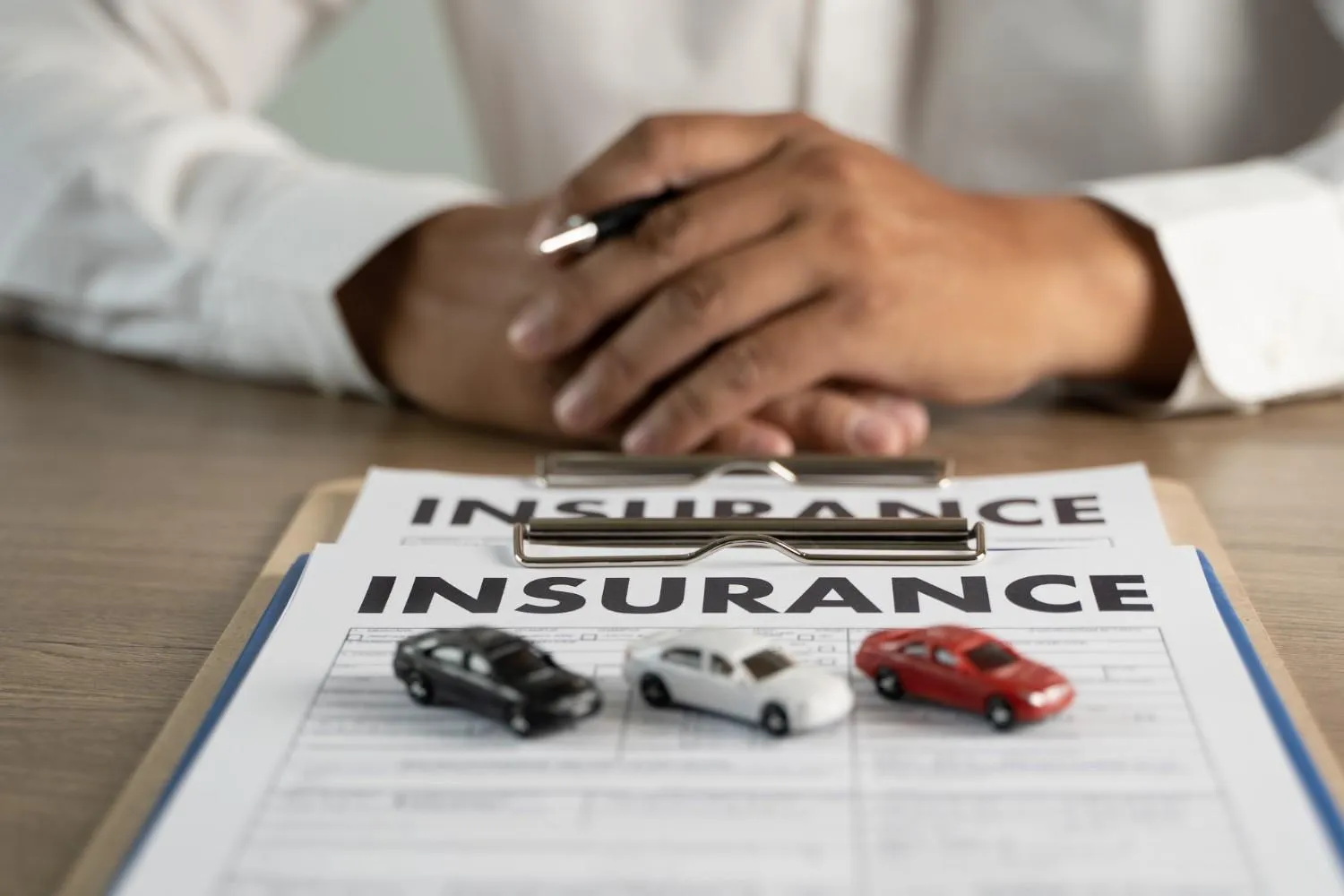 Driver reviewing auto insurance options